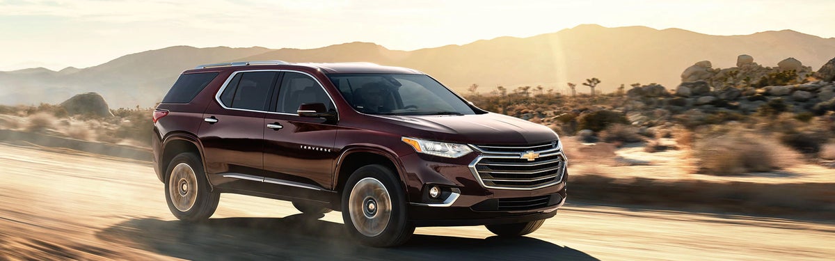 Front-side view of a Chevrolet Traverse driving on the road