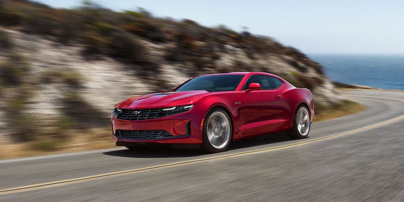 Red 2021 Chevrolet Camaro driving on road