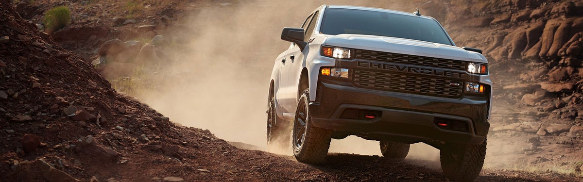 Photo of a Silverado 1500 diriving on a rocky terrain