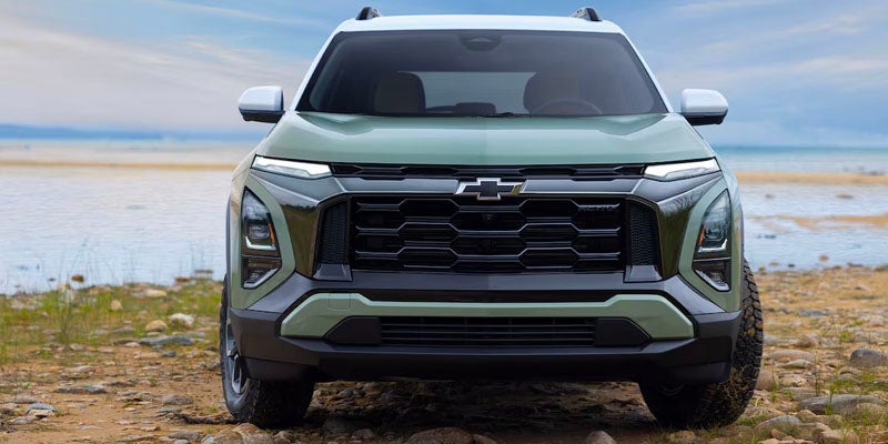 Front view of a 2025 Chevrolet Equinox parked in front of lake