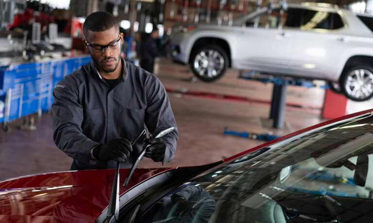 Tech Replacing Window Wiper